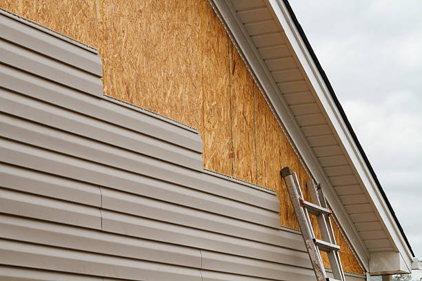 Professional Storm Damage Siding Repair technician working in Old Westbury, NY
